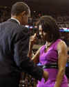 Michelle Obama gives Barack a thumbs up at a Democratic presidential campaign rally in St. Paul, Minnesota on June 3, 2008.