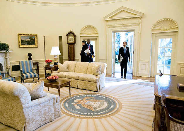 President Barack Obama arrives in the Oval Office of the White House for his first full day of work as US President.