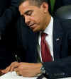 President Barack Obama signs Executive Orders closing Guantanamo Bay within one year and ending use of torture.