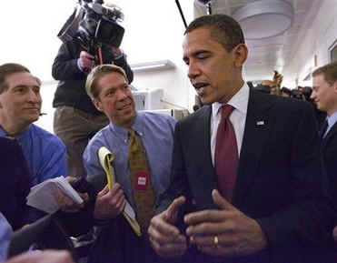 President Barack Obama makes a surprise visit to the crowded Brady Press Briefing Room at the White House.