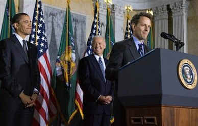President Barack Obama attends the swearing in of Treasury Secretary Timothy Geithner, performed by Vice President Joseph Biden, at the Treasury Department in Washington on January 26, 2009.