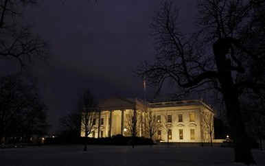 Darkness falls on the White House after a busy Day 9 of Barack Obama's presidency (top).