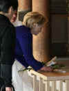 Secretary of State Hillary Clinton visits the Meiji Shrine in Tokyo. Temple priests guide Clinton through the shrine and prepare her for prayers and a sacred tree branch offering (photo) on February 17, 2009.