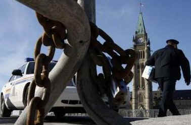 Security preparations continue on Parliament Hill in Ottawa just 48 hours before President Barack Obama's visit to Canada. RCMP and US Secret Service prepare to secure the Parliament grounds, including the installation of concealment tarps, bullet proof glass, and street and pedestrian barriers (photo).