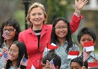 Secretary of State Hillary Clinton arrives in Jakarta, Indonesia and is greeted by elementary students from President Barack Obama's former Indonesian school when he lived in Jakarta with his mother in the early 1970s.