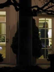 President Obama returns from his one-day visit to Canada and goes to Oval Office in the White House to continue working. The President's staff hand him papers and Obama talks on his Blackberry (photo).