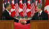 President Barack Obama and Prime Minister Stephen Harper hold a joint news conference on Parliament Hill after private meetings.