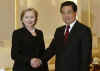 Clinton meets with Chinese President Hu Jintao at the Great Hall of the People in Beijing.
