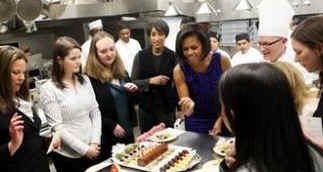 First Lady Michelle Obama meets with White House Executive Chef Cristeta Comerford and the White House kitchen staff to preview the meals for the Governors Dinner in the State Dining Room later that evening. 