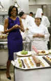 First Lady Michelle Obama meets with White House Executive Chef Cristeta Comerford (photo) and the White House kitchen staff to preview the meals for the Governors Dinner in the State Dining Room later that evening. 