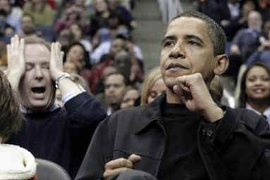 Obama reacts to Chicago basket. President Obama and his friend Marty Nesbitt watch the NBA match between the Washington Wizards and the Chicago Bulls at the Verizon Center in Washington. Obama is a Bulls fan, however the Wizards won the game 113-90.