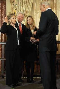 Hillary Clinton is officially sworn in as US Secretary of State by Vice President Joe Biden at the State Department in Washington on February 2, 2009. Guests for the ceremony included former Secretaries of State James Baker and Henry Kissinger. and celebrities like Chevy Chase. Daughter Chelsea and husband Bill Clinton joined the ceremony, with former President Bill Clinton holding the Bible for the swear-in.