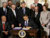 President Barack Obama signs the $32.8 billion State Children's Health Insurance Program in the East Room of the White House on February 4, 2009.