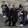 President Barack Obama leaves the Capitol Building after a St. Patrick's Day luncheon with Ireland's Prime Minister Brian Cowen. President Obama. led by a bagpiper, walks down the Capitol Hill stairs with PM Brian Cowen, and Speaker of the House Nancy Pelosi.