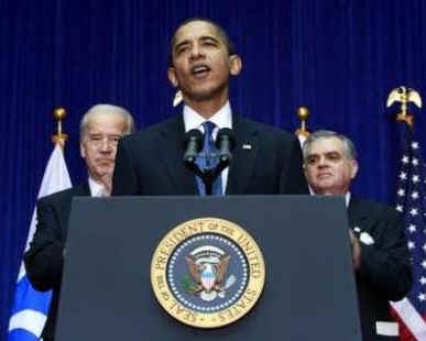 President Barack Obama joins with Vice-President Joe Biden and Transportation Secretary Ray LaHood at the Department of Transport in Washington on March 3, 2009.