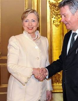 Secretary of State Hillary Clinton arrives in Brussels for dinner at the Egmont Palace with NATO and European Union foreign ministers. Clinton is greeted by Belgium Foreign Minister Gucht.
