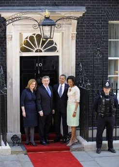 President Barack Obama and First Lady Michelle Obama are greeted by UK PM Gordon Brown and his wife Sarah at 10 Downing Street.