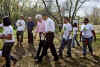 President Barack Obama and former President Bill Clinton after planting trees with volunteers.