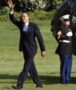 President Obama waves after Marine One arrives on the South Lawn of the White House on April 22, 2009.