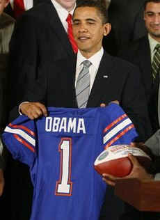 The Gators football team presented President Obama with a Championship football and a personalized team jersey.