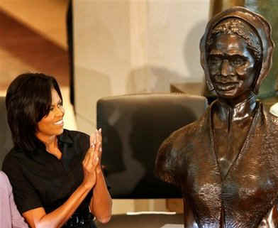 First Lady Michelle Obama, Secretary of State Hillary Clinton, Speaker of the House Nancy Pelosi and other guests join in an unveiling ceremony of the sculpted bust of Sojourner Truth.