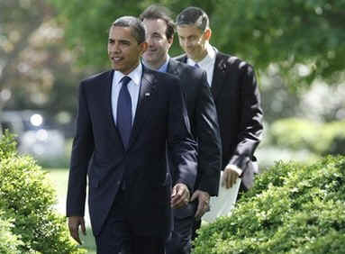 President Barack Obama arrives at a Teacher of the Year ceremony with Education Secretary Arne Duncan and Award Winner Anthony Mullen in the Rose Garden of the White House on April 28, 2009.