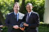 President Barack Obama at Teacher of the Year ceremony with Award Winner Anthony Mullen in the Rose Garden of the White House on April 28, 2009.