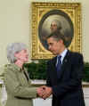 President Barack Obama joins the swearing in ceremony of Kathleen Sebelius as the new Secretary of Health and Human Services in the Oval Office of the White House on April 28, 2009. 
