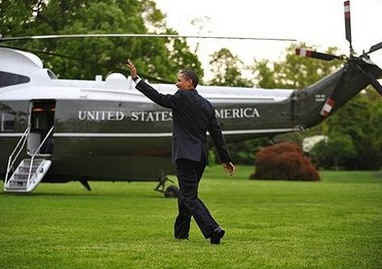 President Barack Obama walks across the South Lawn of the White House to board Marine One.