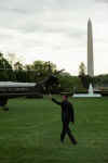 President Barack Obama walks across the South Lawn of the White House to board Marine One.