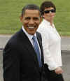 President Barack Obama leaves the town hall meeting with Senior Adviser Valerie Jarrett.