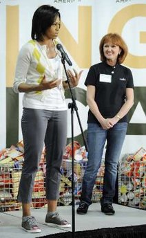 First Lady Michelle Obama and Second Lady Jill Biden join spouses of Members of Congress and other volunteers at a Capital Area Food Bank.