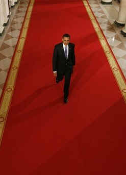 President Barack Obama in the Cross Hall of the White House on his way to speak at a prime time press conference on the 100th day anniversary of his presidency on April 29, 2009.