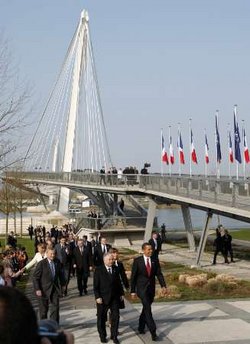 President Barack Obama and the NATO leaders walk in a ceremonial crossing of the Passarelle Mimram (Two Banks) Pedestrian Bridge from Kehl, Germany to Strasbourg, France on April 4, 2009.