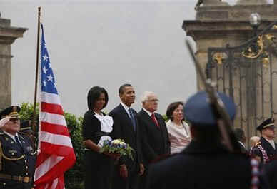 President Barack Obama and First Lady Michelle Obama conclude the Prague welcoming ceremonies watching the presentation of the American and Czech national anthems in the square of the Prague Castle with Czech President Klaus.