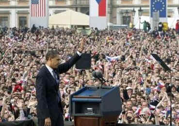President Barack Obama waves after he delivers a speech to an estimated 25,000 people in Hradcanske Square in the Old City part of Prague, the capital of the Czech Republic.