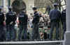 Czech police control crowds as Michelle Obama tours a Jewish synagogue and museum, an ancient Jewish cemetery.