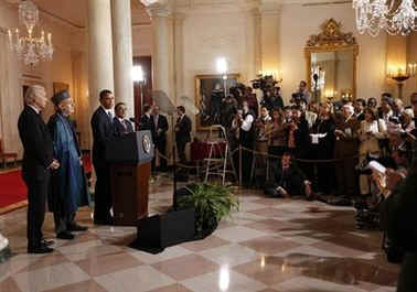 President Barack Obama speaks to the media in the Grand Foyer of the White House after trilateral meetings.