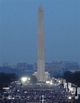 Early morning crowds fill the National Mall around the Washington Monument down to the Lincoln Memorial.