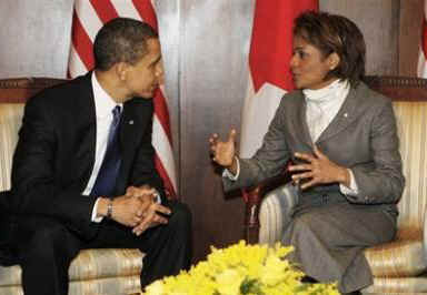 President Barack Obama meets with Governor General Michaelle Jean at the Canada Reception Center at Ottawa airport.