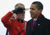 President Barack Obama is greeted at the airport by Canadian Governor General Michaelle Jean at Ottawa airport.