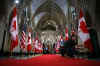 Canadian and American flags are alternately placed down the Hall of Honour in Parliament Hill on February 18, 2009.