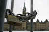 Barricades and locks surround Parliament Hill but Canadians with a message post banners on lamp posts and bridges.