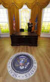 The press is invited to the unveiling of a Barack Obama wax replica in a mock-up of the Oval Office in the White House.