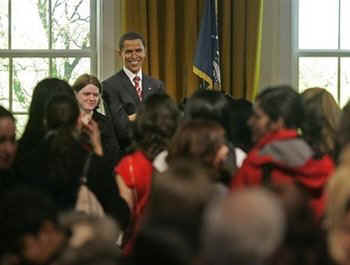 US tourists celebrate Barack Obama's inauguration at Madame Tussauds Wax Museum in London on January 20, 2009.