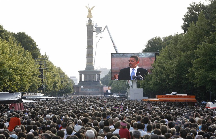 Senator Barack Obama gives a speech in front of hundreds of thousands of Berliners. Barack Obama called on Europe and the United States to stand together again during his Berlin, Germany speech on July 24, 2008. Obama's Berlin speech. in front of the Victory Column, was his only public speech on European tour which included a trip to London.