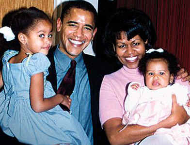 The Senator Barack Obama family in 2002. From left to right are Malia Ann, Barack, Michelle, and Sasha Obama.