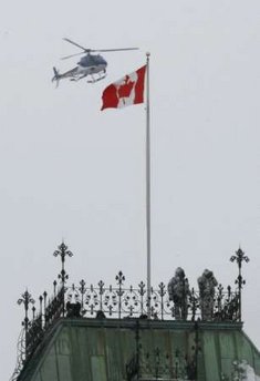 President Barack Obama arrives on Parliament Hill with bullet proof glass at the entrance to Parliament. Rooftop snipers and helicopters patrolling above are part of the heavy security surrounding President Obama's Canadian visit.