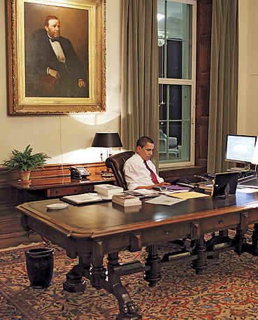 US President Barack Obama reads letters in the Residence Office of the White House. Photo © Time 2009.