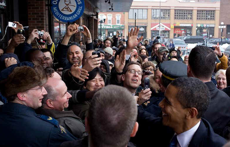 President Obama attracts a crowd after an unscheduled stop at Ottawa's Byward Market Square near the US Embassy in Ottawa.